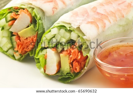 Fresh healthy prawn and salad sushi roll with sweet chili dipping sauce