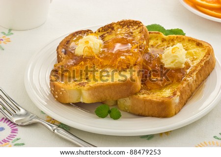 Freshly cooked French Toast with warm Marmalade and whipped butter