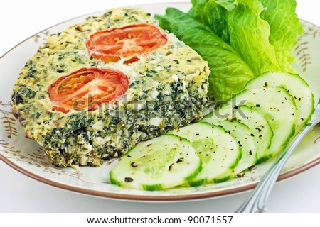Spinach and feta cheese quiche with lettuce and cucumber