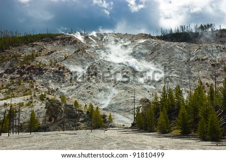 Fumaroles of escaping steam cover the face of Roaring Mountain in Yellowstone National Park, Wyoming