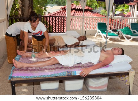 Thailand, Phuket, Pa Tong. - April 26:  Men get a Thai massage. Thailand, Phuket, Pa Tong.  April 26, 2012  in Pa Tong, Thailand.  Patong Lodge Hotel
