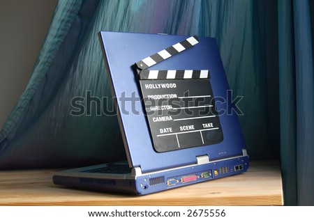 clapperboard on a laptop to represent digital movie making