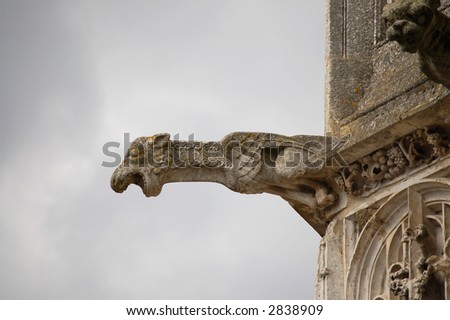 gothic gargoyle jutting out from a church