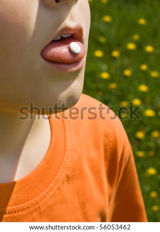 Boy using pill for him pollen allergies