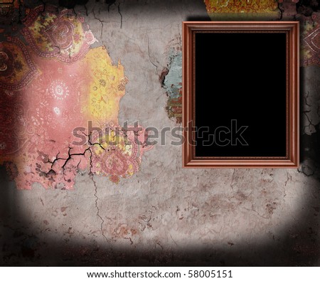 Empty frame on old wall