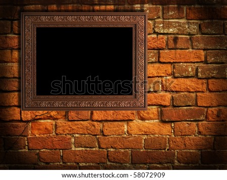 Empty frame on old wall