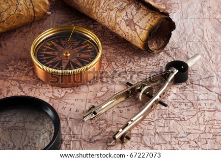 Old compass on grunge background