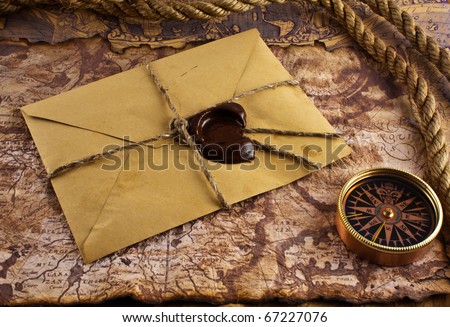 compass and an old letter on grunge background