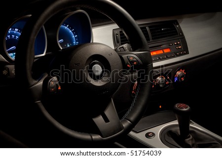 Sports car interior with dramatic night time lighting