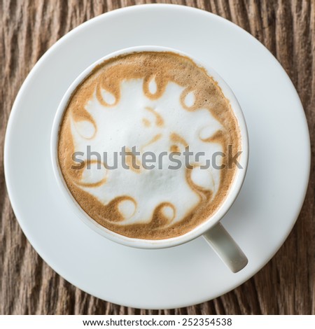 a cup of vintage coffee on the old wood background