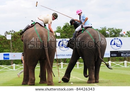 HUA HIN, THAILAND -SEPTEMBER 8: Unidentified polo players try to seize the ball during the 2011 King 's Cup Elephant Polo match on September 8, 2011 at Suriyothai Camp in Hua Hin, Thailand.