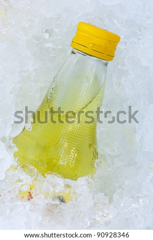 yellow mineral salts drink water bottle in ice cube