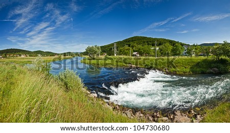 Panorama view of the flow of River Gacka near Oto?ac, Croatia - a place where the original flow of the river is diverted into a channel leading to the hydro power plant