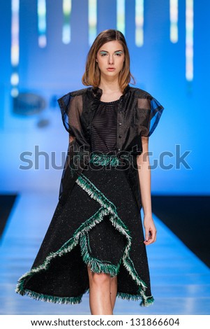 ZAGREB, CROATIA - MARCH 15: Fashion model on catwalk wearing clothes designed by Young (at) Squat on the \'Fashion.hr\' show on March 15, 2013 in Zagreb, Croatia.
