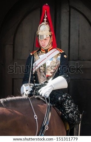 LONDON - SEP 12: Royal Guard mounted trooper of Blues and Royals in front of Horse Guards on September 12, 2010 in London. They are the oldest and most senior regiments in the British Army.
