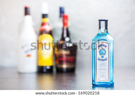 ZAGREB, CROATIA - DECEMBER 29, 2013: Bombay Sapphire gin, mix of 10 ingredients. It\'s produced by Bacardi and is bottled in flat-sided sapphire-colored bottle with Queen Victoria\'s picture on label.