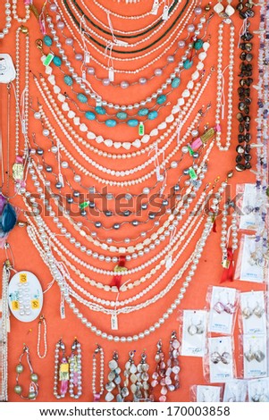 ZADAR, CROATIA - AUGUST 5, 2008: Handmade jewelry with prices on display offered to tourists at the market on streets of Zadar, Croatia during summer holidays.