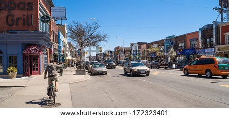 TORONTO, CANADA - MAY 2, 2007: Houses and shops in Greektown on the Danforth in Toronto. The Danforth area is one of major areas of settlement of Greek immigrants to Toronto.