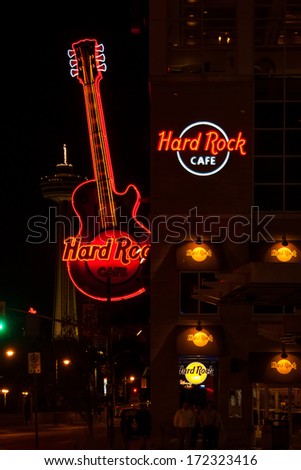 NIAGARA FALLS, CANADA - MAY 5, 2007: Neon sign of famous Hard Rock Cafe Guitar on display. Apart from being a restaurant, the Hard Rock Cafe is a museum with collection of legacy of rock & roll.