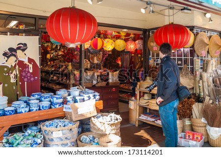 VANCOUVER, CANADA - MAY 16, 2007: Unidentified man shoping around in a Chinese shop in Chinatown. It is Canada\'s largest Chinatown and is one of the largest historic Chinatowns in North America.
