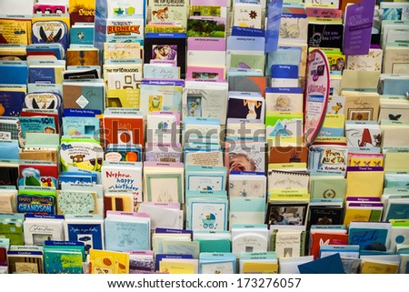 VANCOUVER, CANADA - MAY 16, 2007: Postcards and greeting cards displayed on a rack, for sale, in a souvenir shop in Vancouver downtown.