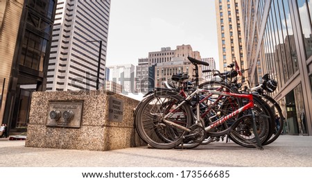VANCOUVER, CANADA - MAY 10, 2007: Bicycles parked on the street in downtown Toronto Financial District, financial capital of Canada with 5 largest financial institutions of Canada situated there.
