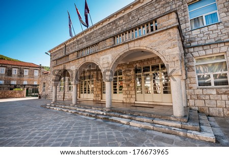 BLATO, CROATIA - AUGUST 9, 2010: Entrance to the government and municipality building located in the Blato on the Korcula island. It hosts city council, government offices and mayor office.