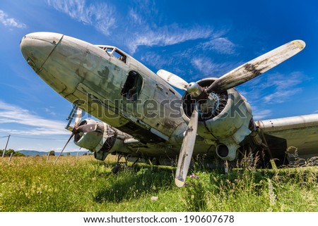 Remains of an abandoned Dakota DC3 aircraft from World War II on an airfield near Otocac, Croatia