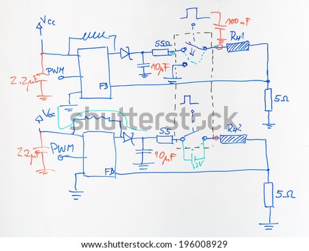Electrical scheme hand drawn with blue and red pen on the school board as an example during lectures on electrical circuits