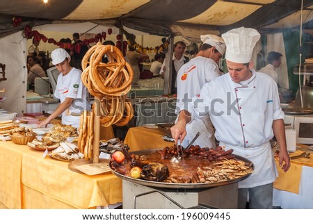 VARAZDIN, CROATIA - SEPTEMBER 2, 2007:  Professional cook cooking on the stand during Spancirfest festival, held yearly since 1999 that lasts for 10 days and hostsing over 100,000 tourists.