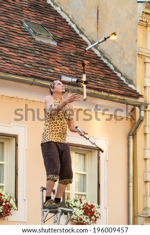 VARAZDIN, CROATIA - SEPTEMBER 2, 2007: Fire torch juggler performing during Spancirfest festival. It is street festival held every year since 1999 and lasts for 10 days, hosting over 100,000 tourists.