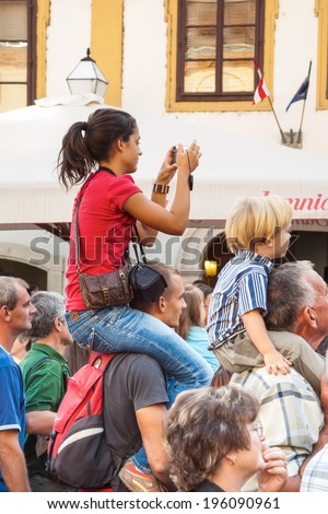 VARAZDIN, CROATIA - SEPTEMBER 2, 2007: Tourists and visitors in the audience of a cultural event during Spancirfest festival, street festival held yearly since 1999 which hosts over 100,000 tourists.