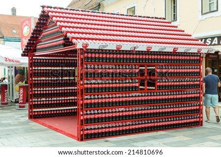 VARAZDIN, CROATIA - AUGUST 31, 2014: Coca Cola stand made of plastic bottles of Coca Cola during Varazdin Spanirfest festival. Coca Cola Company is leading soda drinks manufacturer in the world.
