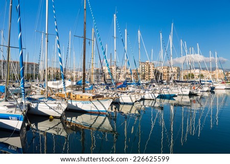 PALERMO, ITALY - OCTOBER 22, 2014: Boats and yachts parked in old port in Palermo, in La Cala bay. Palermo is located in the northwest of the island of Sicily, right by the Gulf of Palermo.