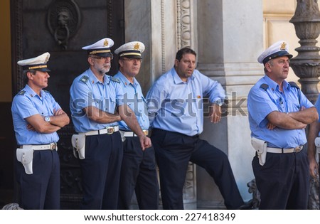 PALERMO, ITALY - OCTOBER 21, 2014: Italian police security officers on Piazza Pretoria in Palermo. Palermo is capital of both the autonomous region of Sicily and the Province of Palermo.