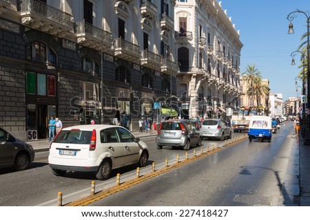 PALERMO, ITALY - OCTOBER 21, 2014: People and traffic on the streets of Palermo. Palermo is capital of both the autonomous region of Sicily and the Province of Palermo.
