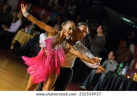 ZAGREB, CROATIA - OCTOBER 26, 2008: Ballroom dancers Ivan Knezevic and Milena Zogovic, representing Slovenia, dancing latino dances and competing during DSF Open Adults dm Grand Prix 2008.
