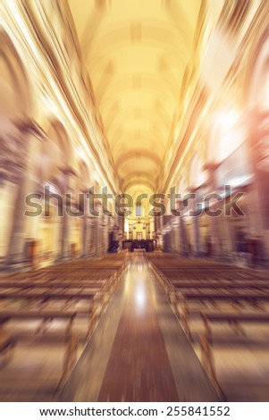 Interior of a baroque church. Radial zoom effect defocusing filter applied, with vintage instagram look