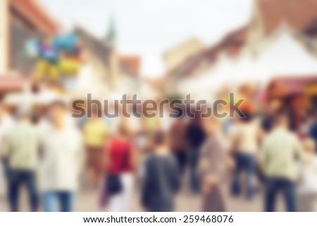 Abstract group of people in the city background, urban life with many people on the street. Blurred in post processing.