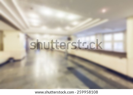 Abstract blurred background of modern university hall and student service desk. Blur effect defocusing filter applied, with vintage instagram look.