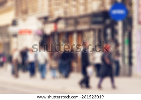 Abstract background - people shopping and walking in main shopping street in Zagreb, Croatia - lens blur effect defocusing filter applied, with vintage instagram look.