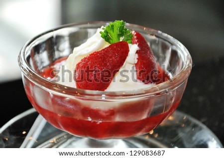 Strawberry dessert. Dessert with whipped cream. It is decorated with strawberries.