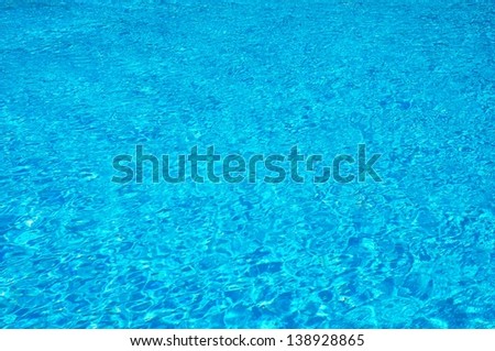 Clean water in blue swimming pool. Abstract reflection.