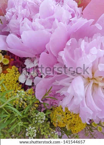 Mixed bouquet of summer flowers with peony