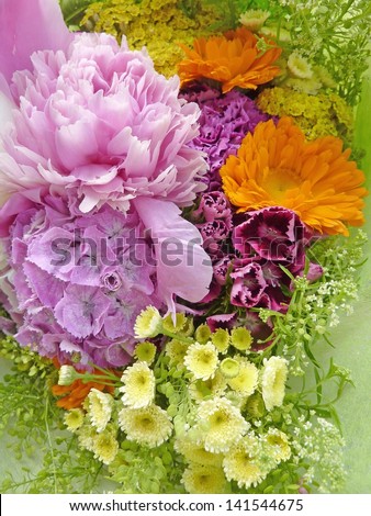 Mixed bouquet of summer flowers with peony