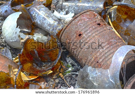 Macro shot of a pile of broken glass and debris that has been burned in a garbage dump