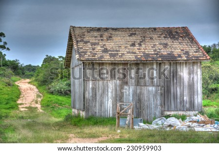 Wood shack in the middle of a farm field in the Brazilian countryside