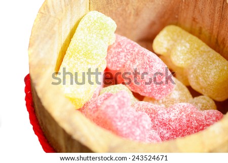 Macro shot of jelly candies in a wooden box with selective focus