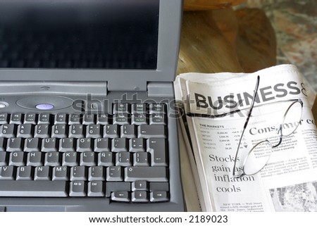 Laptop and Newspaper