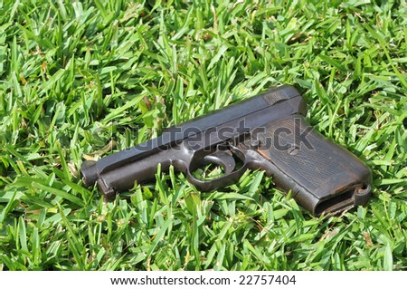 Old gun on a grass field